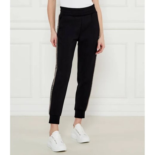 GUESS Spodnie dresowe VICTOIRE | Regular Fit ze sklepu Gomez Fashion Store w kategorii Spodnie damskie - zdjęcie 184518157