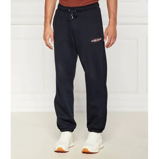 Guess Jeans Spodnie dresowe | Regular Fit ze sklepu Gomez Fashion Store w kategorii Spodnie męskie - zdjęcie 184518709