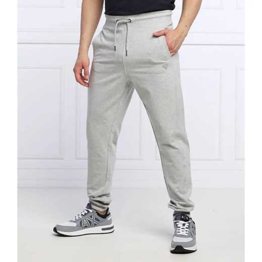 GUESS Spodnie dresowe Adam | Relaxed fit ze sklepu Gomez Fashion Store w kategorii Spodnie męskie - zdjęcie 184519788