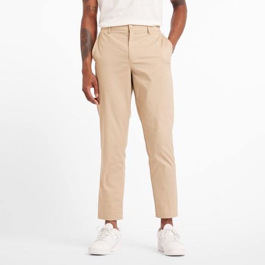 Spodnie męskie New Balance MP43554SOT – beżowe ze sklepu New Balance Poland w kategorii Spodnie męskie - zdjęcie 184542316