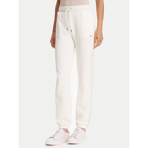 Guess Spodnie dresowe V5YB06 KBSL2 Écru Regular Fit ze sklepu MODIVO w kategorii Spodnie damskie - zdjęcie 184547005