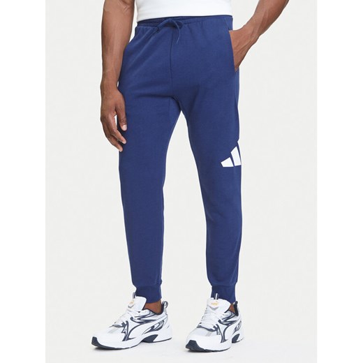 adidas Spodnie dresowe Essentials Big Logo JE8967 Granatowy Regular Fit ze sklepu MODIVO w kategorii Spodnie męskie - zdjęcie 184553469