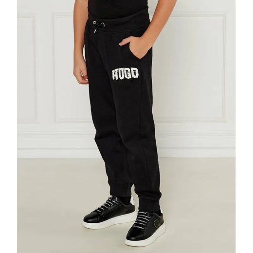 HUGO KIDS Spodnie dresowe | Regular Fit ze sklepu Gomez Fashion Store w kategorii Spodnie chłopięce - zdjęcie 184555617