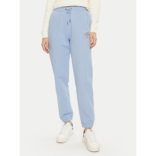 Guess Jeans Spodnie dresowe W5RB63 K68I4 Niebieski Regular Fit ze sklepu MODIVO w kategorii Spodnie damskie - zdjęcie 184575325