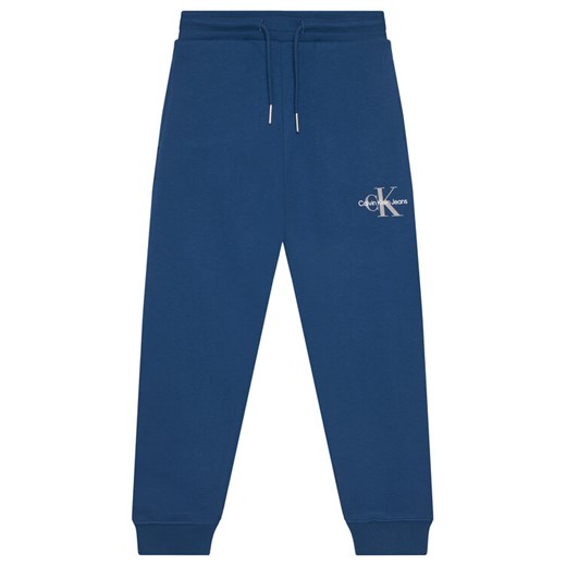 Calvin Klein Jeans Spodnie dresowe Monogram Logo IU0IU00285 D Niebieski Regular Fit ze sklepu MODIVO w kategorii Spodnie chłopięce - zdjęcie 184613288