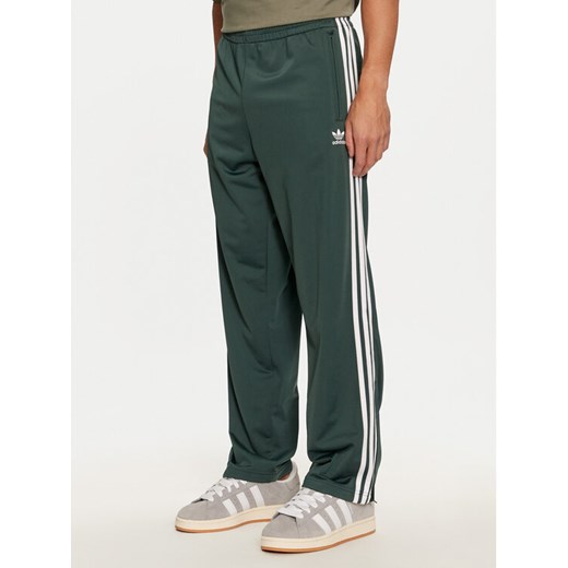 adidas Spodnie dresowe adicolor Classics Firebird IY9899 Zielony Regular Fit ze sklepu MODIVO w kategorii Spodnie męskie - zdjęcie 184623389