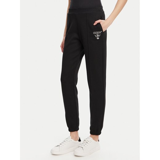 Guess Spodnie dresowe V5RB13 KC3D2 Czarny Regular Fit ze sklepu MODIVO w kategorii Spodnie damskie - zdjęcie 184653419