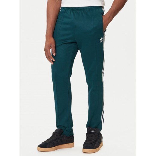 adidas Spodnie dresowe adicolor Classics Beckenbauer JY1275 Zielony Slim Fit ze sklepu MODIVO w kategorii Spodnie męskie - zdjęcie 184657298