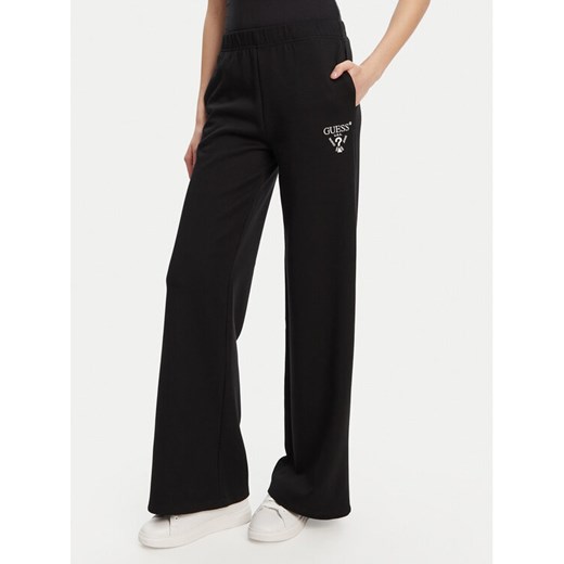 Guess Spodnie dresowe V5RB12 KC3D2 Czarny Regular Fit ze sklepu MODIVO w kategorii Spodnie damskie - zdjęcie 184657416