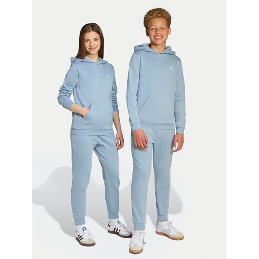 adidas Spodnie dresowe JX2743 Błękitny Regular Fit ze sklepu MODIVO w kategorii Spodnie chłopięce - zdjęcie 184670335