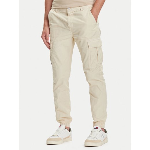 Tommy Jeans Joggery Austin DM0DM21791 Beżowy Slim Fit ze sklepu MODIVO w kategorii Spodnie męskie - zdjęcie 184672798