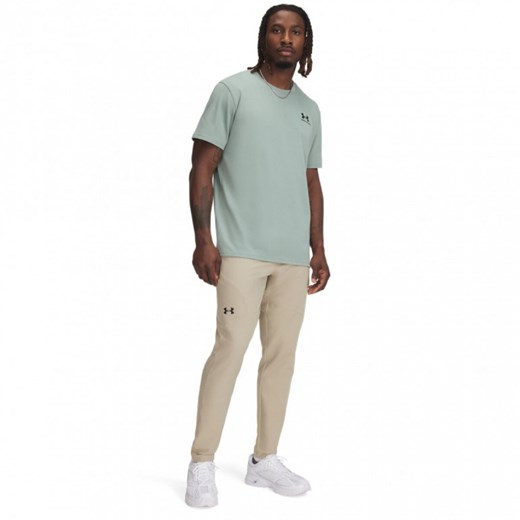 Męskie spodnie treningowe Under Armour UA Unstoppable Tapered Pants - beżowe ze sklepu Sportstylestory.com w kategorii Spodnie męskie - zdjęcie 184675397