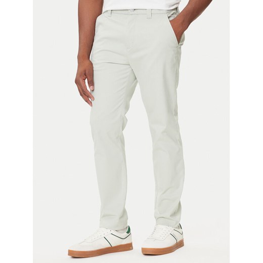 Tommy Jeans Chinosy Austin DM0DM20282 Zielony Slim Fit ze sklepu MODIVO w kategorii Spodnie męskie - zdjęcie 184686816