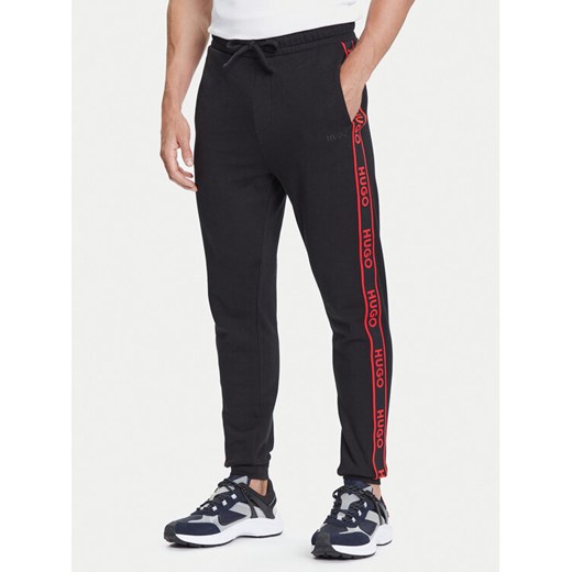 HUGO Spodnie dresowe Liam 50540918 Czarny Regular Fit ze sklepu MODIVO w kategorii Spodnie męskie - zdjęcie 184688527