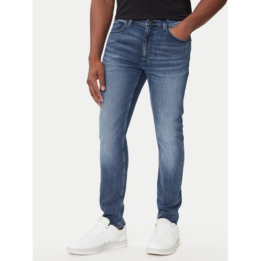 HUGO Jeansy Zane 50541551 Granatowy Extra Slim Fit ze sklepu MODIVO w kategorii Jeansy męskie - zdjęcie 184706727