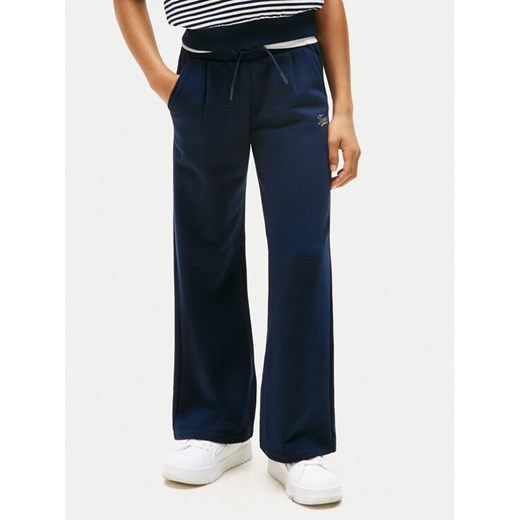 Tommy Hilfiger Spodnie dresowe Script KG0KG08669 Granatowy Wide Leg ze sklepu MODIVO w kategorii Spodnie chłopięce - zdjęcie 184725667