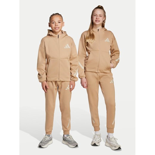 adidas Spodnie dresowe Z.N.E. JW4002 Beżowy Tapered Leg ze sklepu MODIVO w kategorii Spodnie chłopięce - zdjęcie 184769867