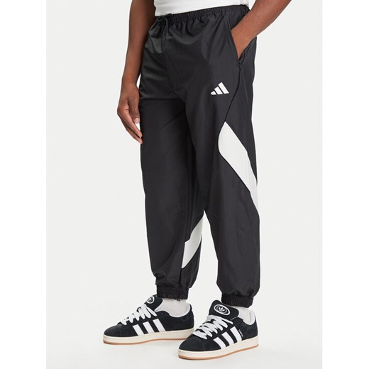 adidas Spodnie dresowe Stadium JN1830 Czarny Loose Fit ze sklepu MODIVO w kategorii Spodnie męskie - zdjęcie 184790325