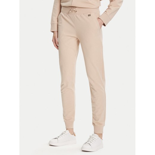 EA7 Emporio Armani Spodnie dresowe 7W000461 AF13135 U1046 Beżowy Regular Fit ze sklepu MODIVO w kategorii Spodnie damskie - zdjęcie 184794197