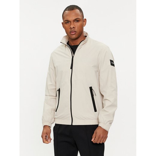Calvin Klein Kurtka przejściowa K10K111441 Beżowy Regular Fit ze sklepu MODIVO w kategorii Kurtki męskie - zdjęcie 184874666