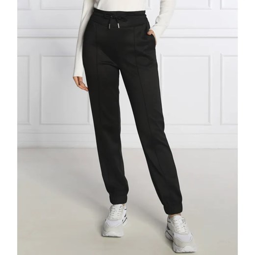 GUESS Spodnie dresowe ARMELLE | Regular Fit ze sklepu Gomez Fashion Store w kategorii Spodnie damskie - zdjęcie 184948368