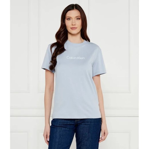 Calvin Klein T-shirt HERO LOGO | Regular Fit ze sklepu Gomez Fashion Store w kategorii Bluzki damskie - zdjęcie 184982499