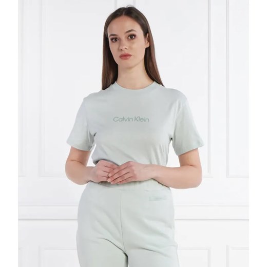 Calvin Klein T-shirt HERO LOGO | Regular Fit ze sklepu Gomez Fashion Store w kategorii Bluzki damskie - zdjęcie 184984718