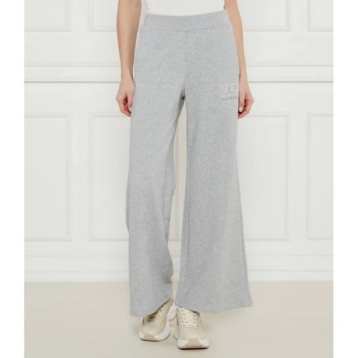 EA7 Spodnie dresowe | flare fit ze sklepu Gomez Fashion Store w kategorii Spodnie damskie - zdjęcie 185001389