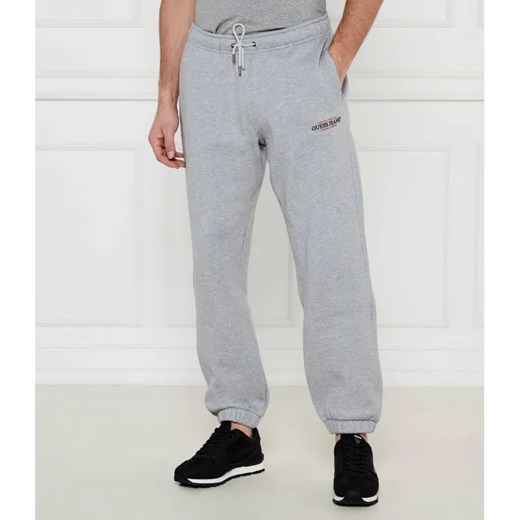 Guess Jeans Spodnie dresowe AMERICAN | Regular Fit ze sklepu Gomez Fashion Store w kategorii Spodnie męskie - zdjęcie 185005235
