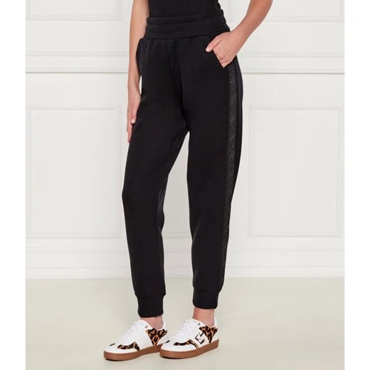 GUESS Spodnie jogger NEW VICTOIRE | Regular Fit ze sklepu Gomez Fashion Store w kategorii Spodnie damskie - zdjęcie 185006556