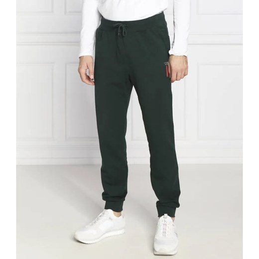 GUESS Spodnie dresowe Adam | Regular Fit ze sklepu Gomez Fashion Store w kategorii Spodnie męskie - zdjęcie 185008105