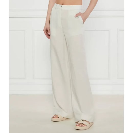 Calvin Klein Spodnie | flare fit | z dodatkiem lnu Calvin Klein 34 wyprzedaż Gomez Fashion Store