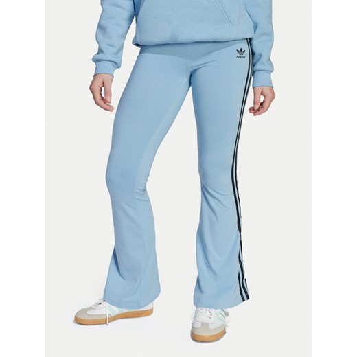 adidas Legginsy adicolor JV8616 Błękitny Slim Fit ze sklepu MODIVO w kategorii Spodnie dziewczęce - zdjęcie 185034629