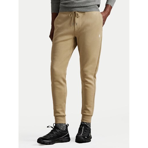 Polo Ralph Lauren Spodnie dresowe 710881518082 Beżowy Regular Fit ze sklepu MODIVO w kategorii Spodnie męskie - zdjęcie 185034897