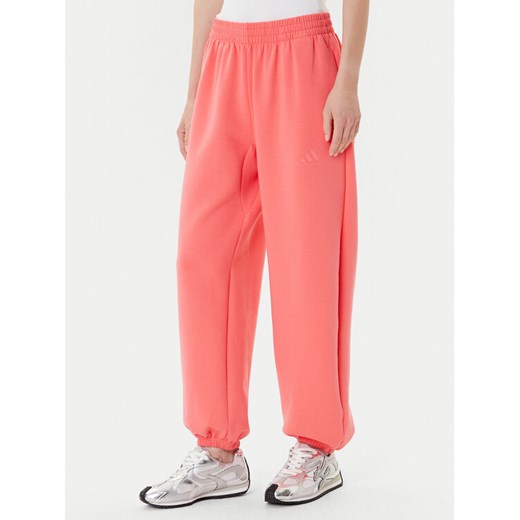 adidas Spodnie dresowe ALL SZN Soft Lux lKD9773 Koralowy Loose Fit ze sklepu MODIVO w kategorii Spodnie damskie - zdjęcie 185039097