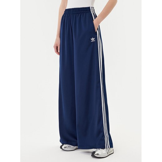 adidas Spodnie dresowe adicolor Satin JD0881 Granatowy Wide Leg ze sklepu MODIVO w kategorii Spodnie damskie - zdjęcie 185040807