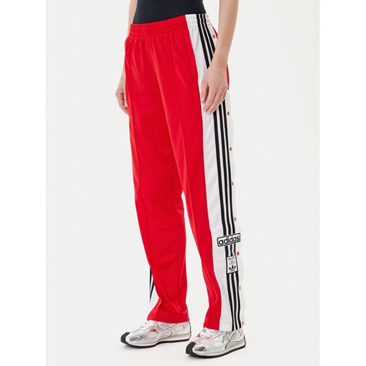 adidas Spodnie dresowe Adibreak JY1354 Czerwony Loose Fit ze sklepu MODIVO w kategorii Spodnie damskie - zdjęcie 185040818