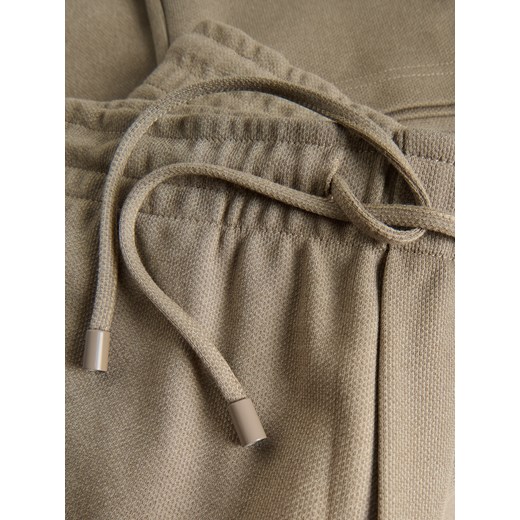 Reserved - Spodnie regular fit - beżowy Reserved XXL Reserved