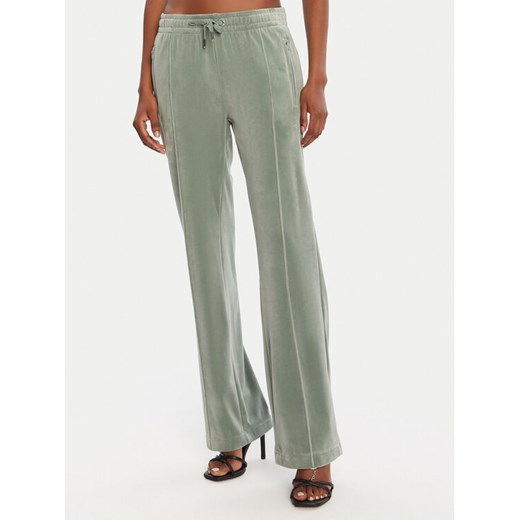 Juicy Couture Spodnie dresowe Tina JCAPW045 Zielony Regular Fit ze sklepu MODIVO w kategorii Spodnie damskie - zdjęcie 185070226