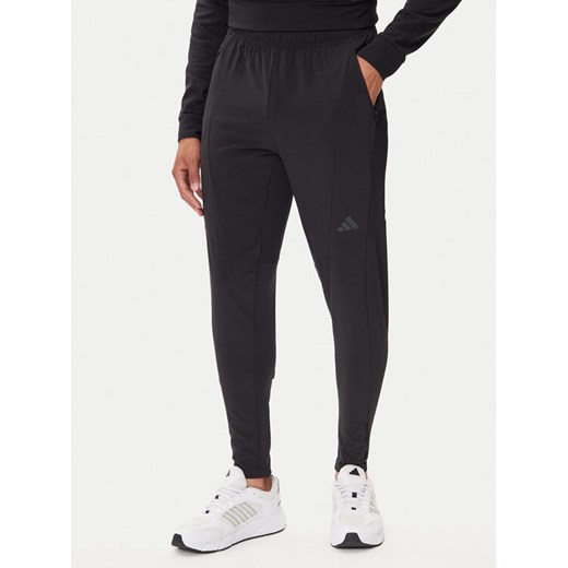 adidas Spodnie dresowe Designed for Training Hybrid IY1123 Czarny Slim Fit ze sklepu MODIVO w kategorii Spodnie męskie - zdjęcie 185391527