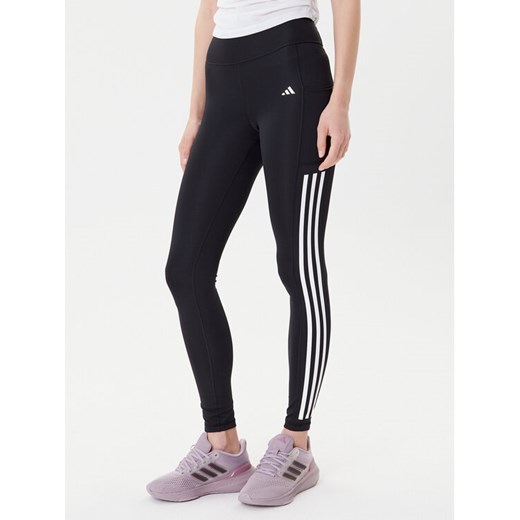 adidas Legginsy Optime 3-Stripes IT9105 Czarny Slim Fit ze sklepu MODIVO w kategorii Spodnie damskie - zdjęcie 185391576