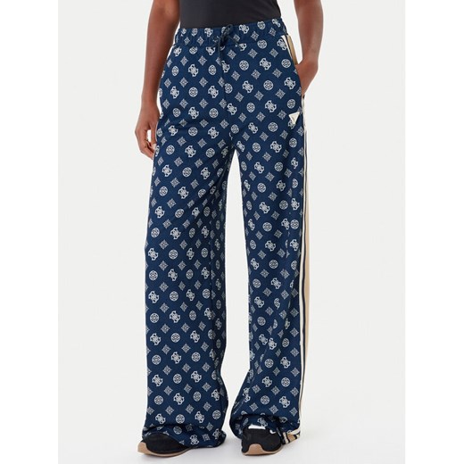Guess Spodnie dresowe V5YB10 K0282 Granatowy Relaxed Fit ze sklepu MODIVO w kategorii Spodnie damskie - zdjęcie 185444049