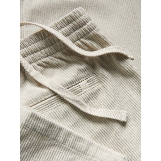 Reserved - Sztruksowe spodnie jogger - złamana biel Reserved S Reserved