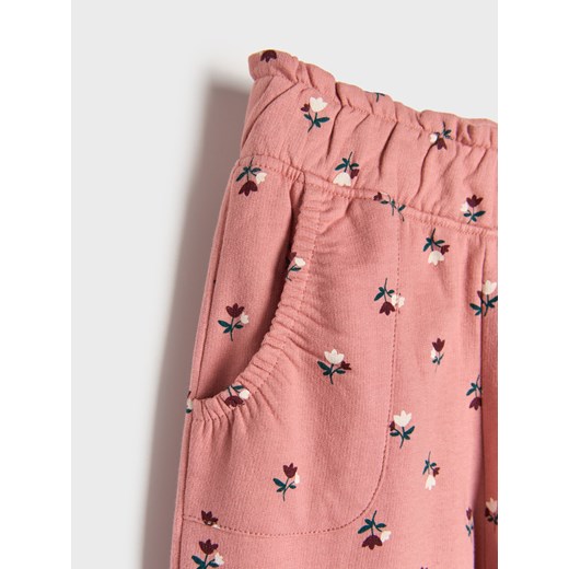 Sinsay - Spodnie dresowe w kwiaty - pomarańczowy Sinsay 122 (6-7 l) Sinsay