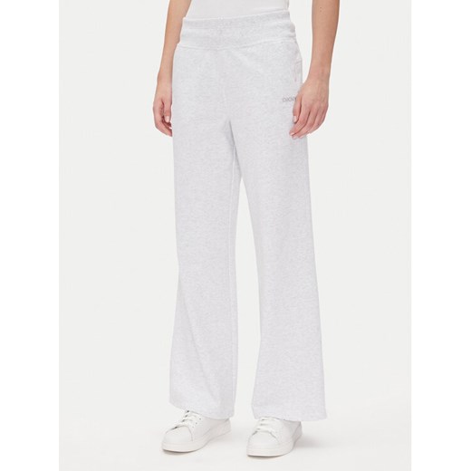 DKNY Sport Spodnie dresowe DP5P3601 Biały Regular Fit ze sklepu MODIVO w kategorii Spodnie damskie - zdjęcie 185469587