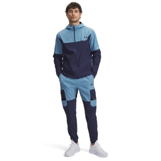 Męskie spodnie treningowe Under Armour UA Tech Utility Woven - niebieskie ze sklepu Sportstylestory.com w kategorii Spodnie męskie - zdjęcie 185482809