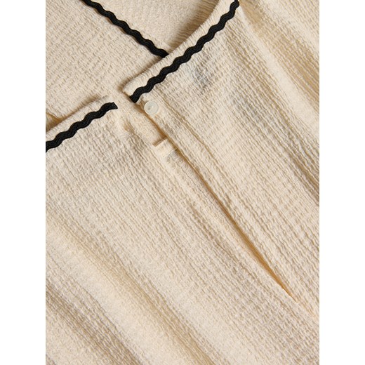 Reserved - Strukturalny kombinezon z lampasem - złamana biel Reserved 134 (8 lat) Reserved