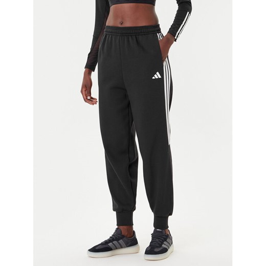 adidas Spodnie dresowe Tiro 3-Stripes JL7488 Czarny Loose Fit ze sklepu MODIVO w kategorii Spodnie damskie - zdjęcie 185510445
