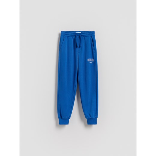 Reserved - Bawełniane spodnie jogger - niebieski - id: 783DO-55X - marki Reserved - 185599616 Reserved - Bawełniane spodnie jogger - niebieski ze sklepu Reserved w kategorii Spodnie chłopięce - zdjęcie 185599616