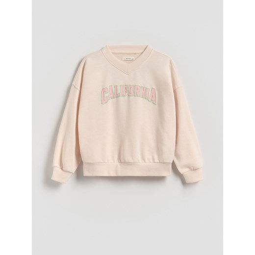 Reserved - Bluza z wypukłym napisem - pastelowy róż ze sklepu Reserved w kategorii Bluzy dziewczęce - zdjęcie 185620605